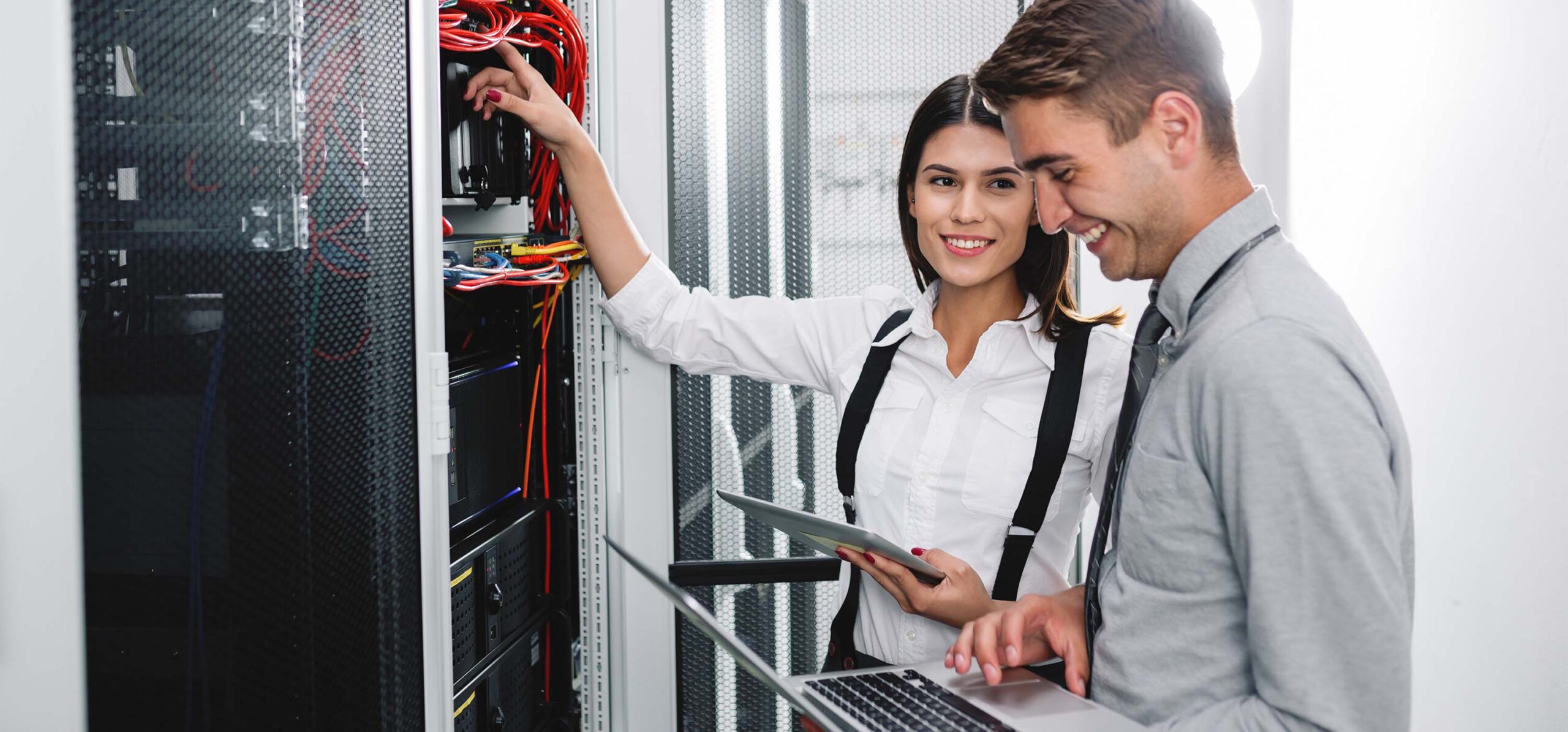 Team of technicians working together on servers at the data cent